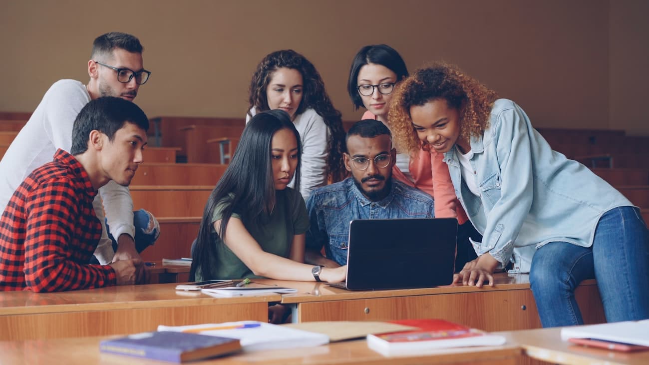 A diverse group of technical students working together